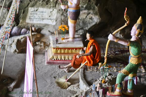Monk Smoking in Laos Cave