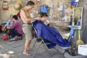 Sidewalk Barber in Asia