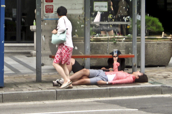 Passed Out Korean at Bus Stop