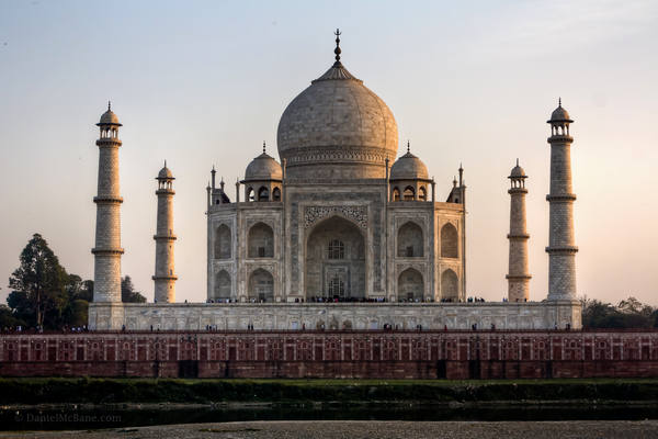 Taj Mahal at dusk across Yamuna River