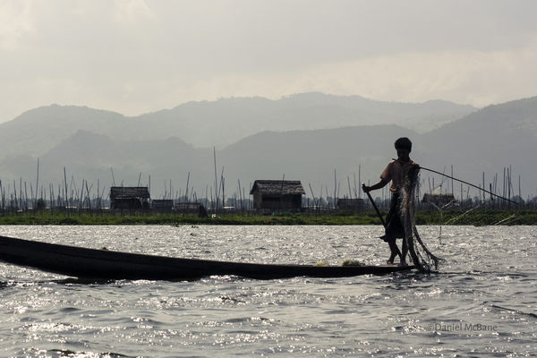 Upright rowing fisherman on Inle Lake in Myanmar