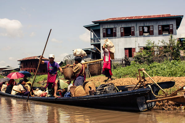 Inle Lake locals loading a boat in Myanmar