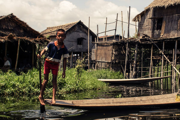A leg-rowing boy on Inle Lake in Myanmar