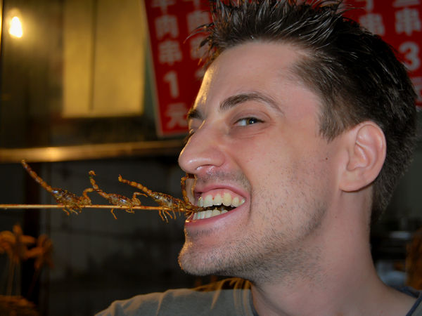 Eating scorpions in Wangfujing, Beijing, China