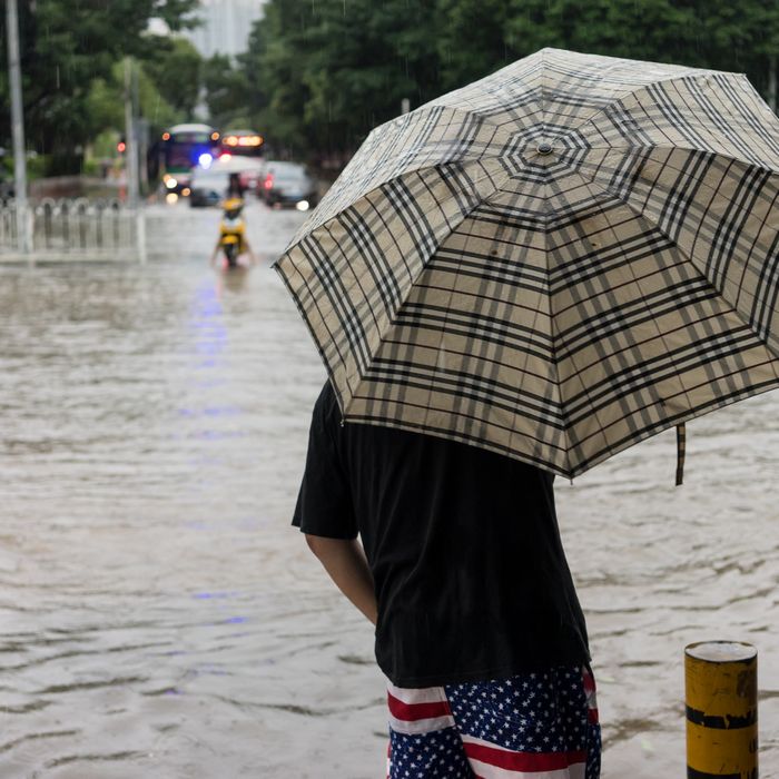 American flag shorts on Chinese man in a flood